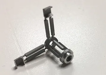 Thin three-legged machined part