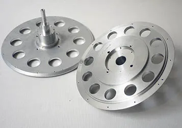 Two aluminum discs with bored holes